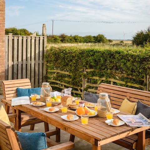 Eat under the warm sun in this gorgeous garden