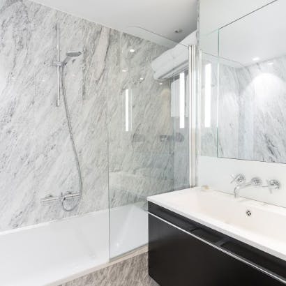 Freshen up in the marble-clad bathroom