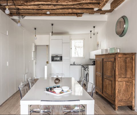 Sit down to fresh coffee and croissants beneath the kitchen's 17th-century beams each morning