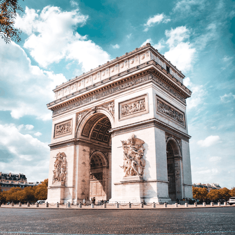 Wander down to the impressive and historical Arc de Triomphe