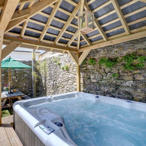 Unwind in the covered hot tub at the end of the day