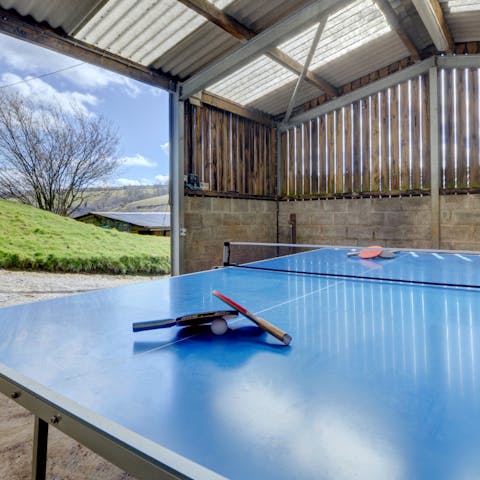 Gather in the barn for a competitive game of table tennis