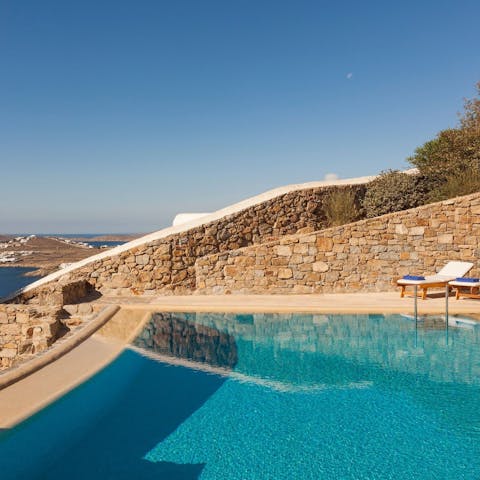 Chill in the pool whilst looking out across the stunning landscape