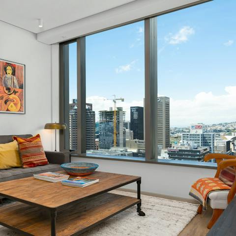 Enjoy the stunning city and mountain views from the living area