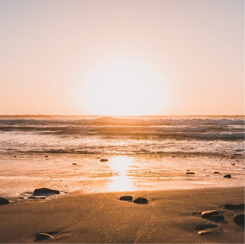 Catch the sunset at Clifton Beach – just a short drive away