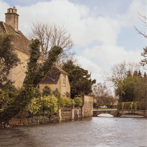 Take the six-minute drive to Bourton-on-the-Water for its low bridges and traditional stone houses