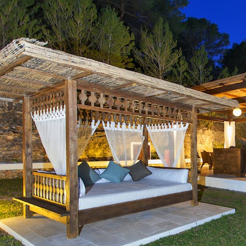 Spend the days relaxing on the rustic Balinese daybed 