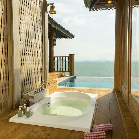 Bathe in style as the ocean stretches out before you in the outdoor bathtub