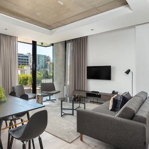 Lounge or dine in lovely light filled surroundings courtesy of floor to ceiling sliding glass doors out onto the balcony