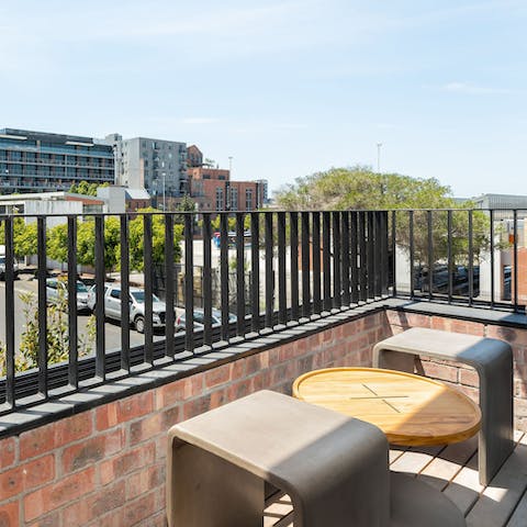 Chill out with a glass of wine on your private balcony and watch the world go by