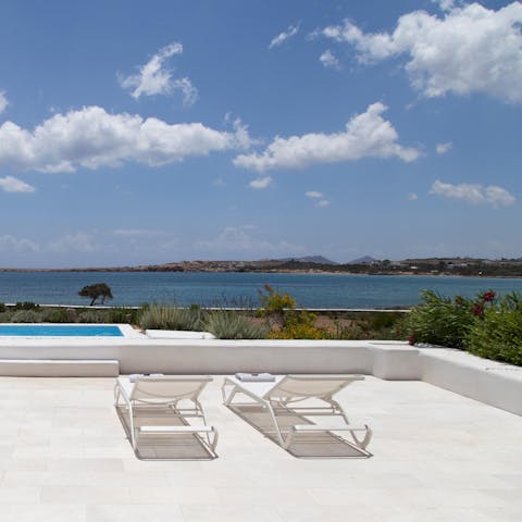 Sunbathe on the loungers while looking out at the panoramic sea views
