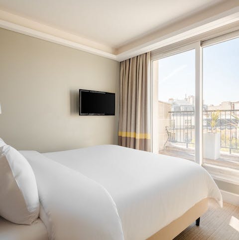 Wake up to views of 17th arrondissement rooftops from the comfortable bed