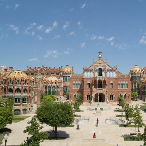 Meander through the tranquil grounds of Modernista De Sant Pau, just a nineteen-minute metro ride away