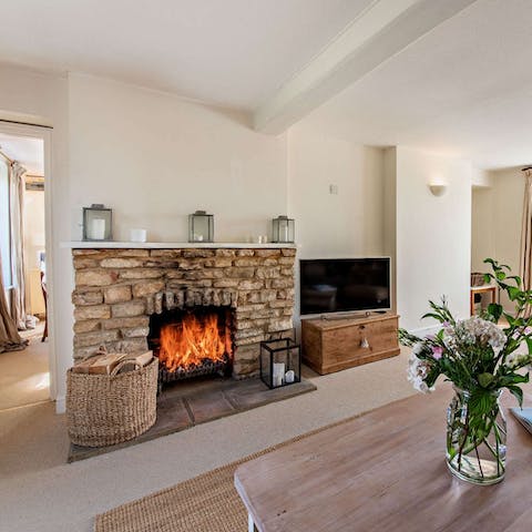 Light the open fire on chilly evenings and get cosy in the living room
