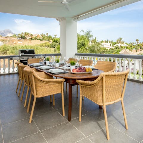 Gather around the dining table on your terrace for a Mediterranean feast off the barbecue, admiring the luscious view around you