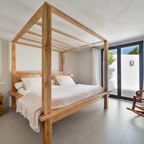 Snooze in the cloud-like four poster bed 