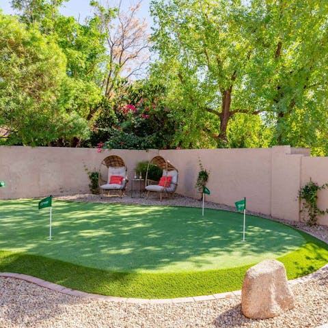 Practice your stroke on the putting green