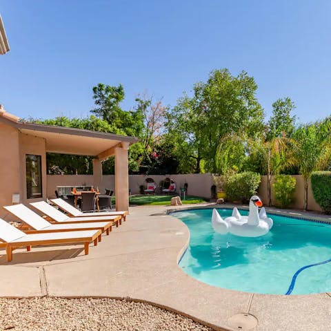 Soak up prime desert sun from a pool raft 