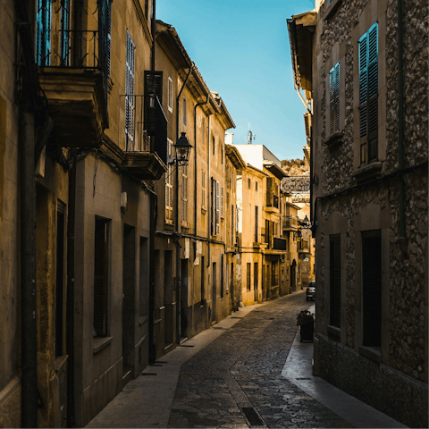 Drive to Pollença and stroll along the cobbled streets