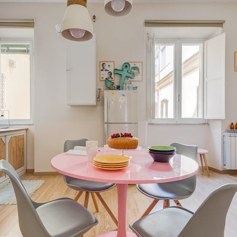 Come together around the chic pink dining table for a slice of cake