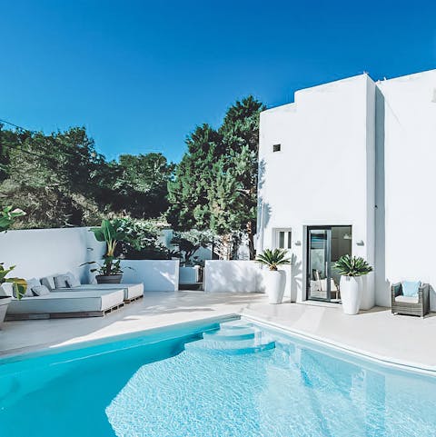Relax poolside with a glass of sangria in hand before enjoying a refreshing swim