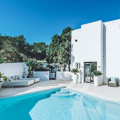 Relax poolside with a glass of sangria in hand before enjoying a refreshing swim