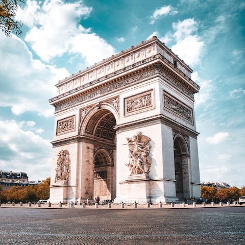 Stroll over to the Arc de Triomphe before shopping along the Champs-Élysées 
