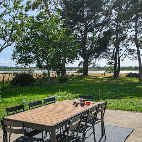 Enjoy alfresco dining on your outdoor table while enjoying views of the nearby lake