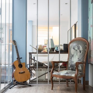 The guitar and the Voltaire armchair