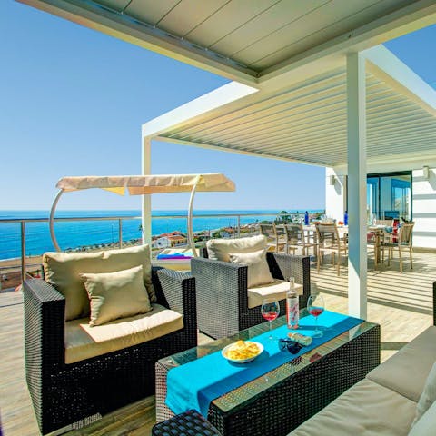 Admire the sea views with a cocktail on the terrace