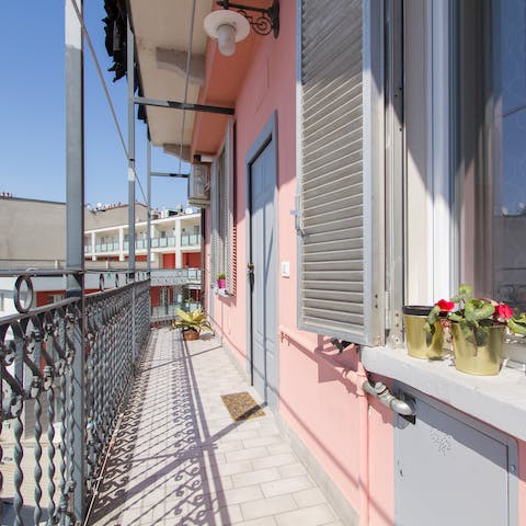 Sip your morning coffee on the communal front balcony while catching some rays
