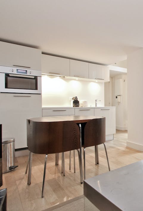 A minimalist open plan kitchen and dining area