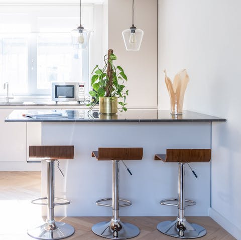 Enjoy sipping your morning coffee at the sleek breakfast bar