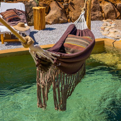Curl up in the hammock above the pool for a nap in the sunshine