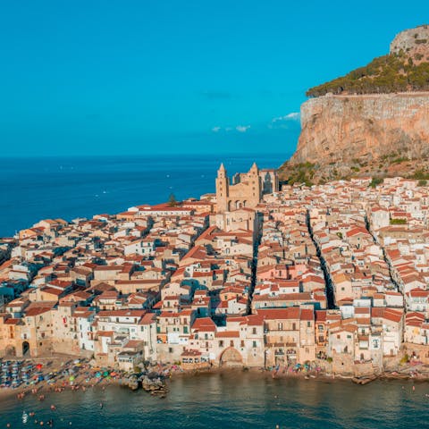 Drive along the coast to the pretty seaside town of Cefalu
