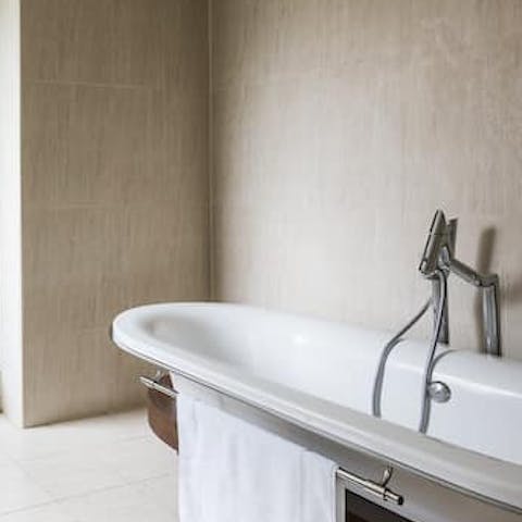 Treat yourself to a long soak in the freestanding bath tub