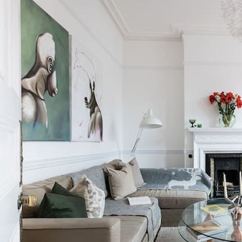 Admire your host's artworks in the elegant living room