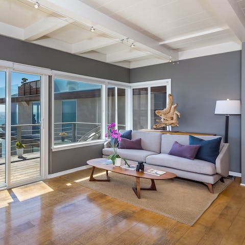 Relax in the bright living space after a swim in the Pacific