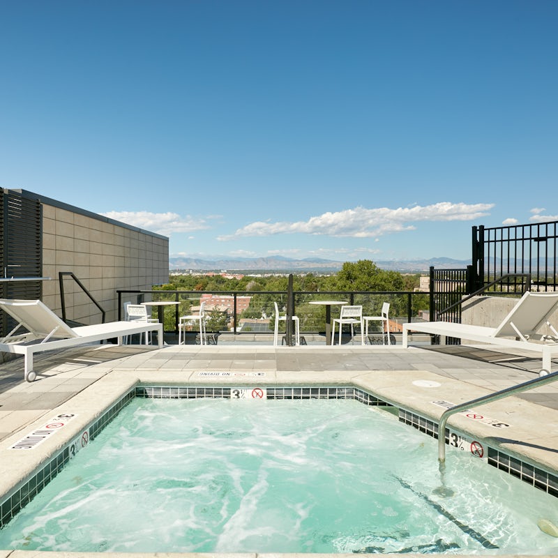 Unwind in the rooftop Jacuzzi with a view out to the mountains
