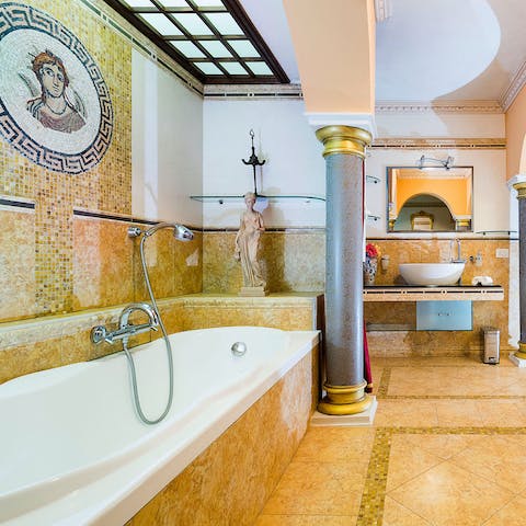 Treat yourself to an uninterrupted soak in the mosaic-tiled bathroom