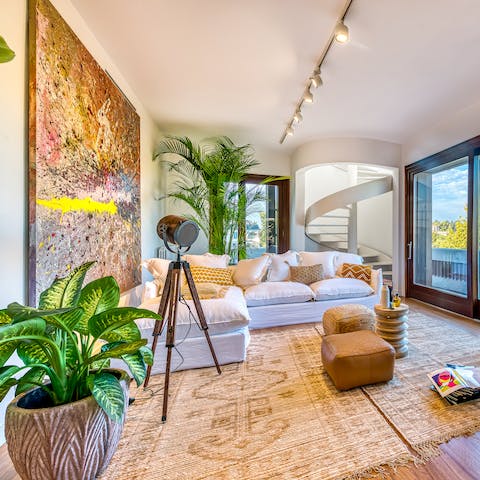 Relax in the lounge, surrounded by plants and artwork