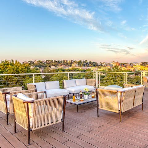 Savour panoramic views across Rome from the penthouse roof terrace