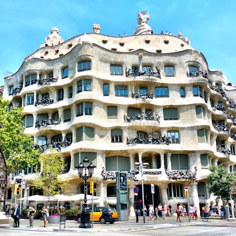 Admire Gaudí's Casa Milà, less than a twenty-minute walk away