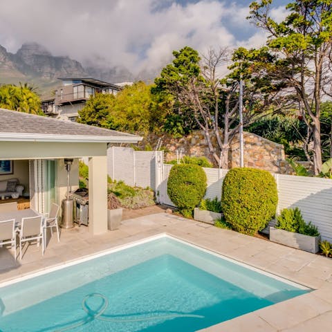 Take a dip in the swimming pool with glorious mountain views as your backdrop 