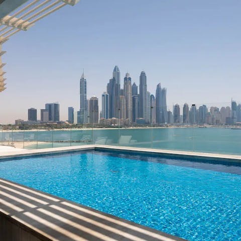 Gaze out at Dubai's iconic skyline as you cool off in the private pool