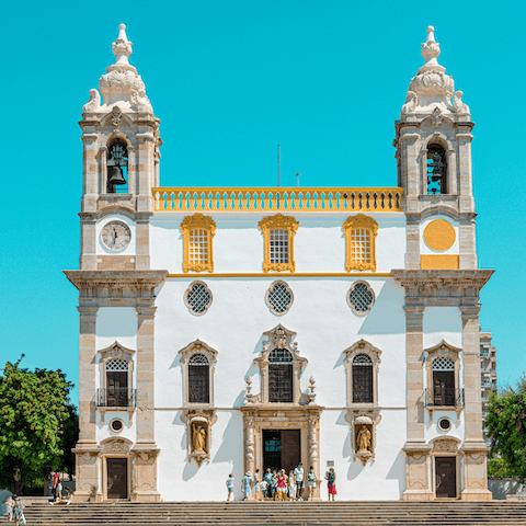 Visit the beautiful baroque Igreja do Carmo, a short walk away