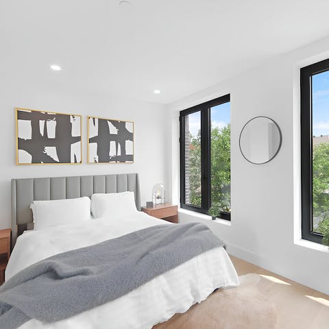 Wake up to serene green views from the double bedroom