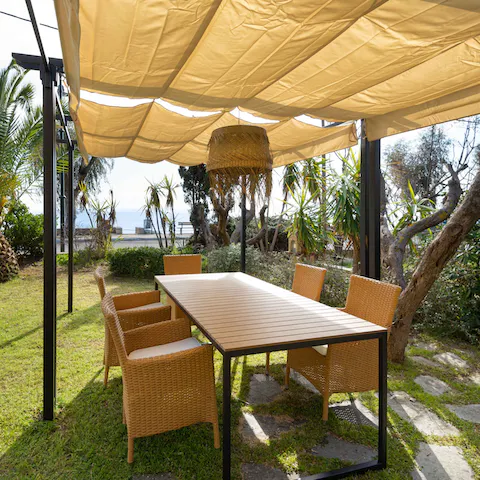 Gather together for a shaded alfresco meal while enjoying the salty breeze