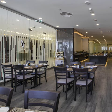 Catch a quick breakfast in the building's on-site restaurant