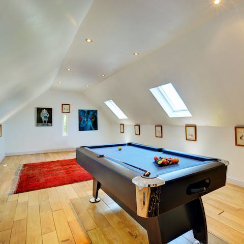 Play a game of pool in the shared games room
